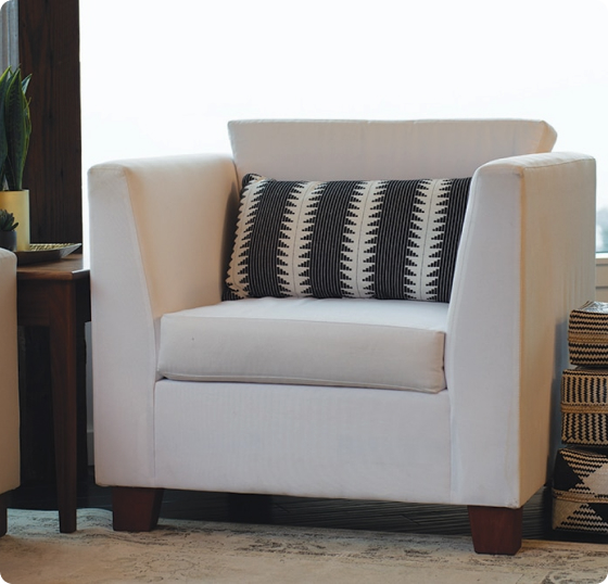 Organic upholstered seating detail in a styled room